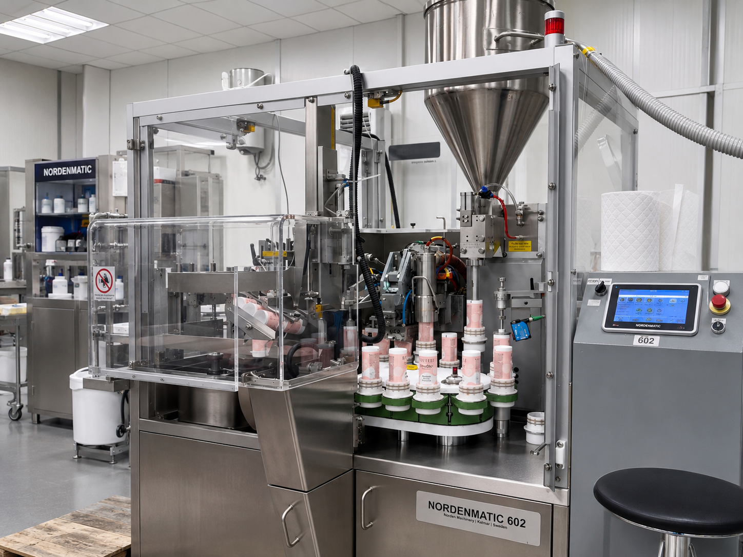 Automated tube filling line inside a REVUELE production facility, filling REVUELE cosmetic tubes