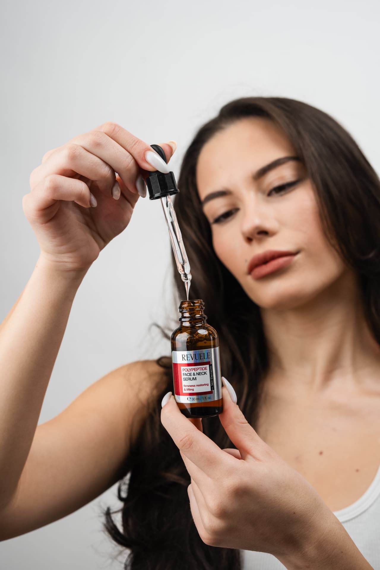 POLYPEPTIDE Face & Neck Serum — packshot in use
