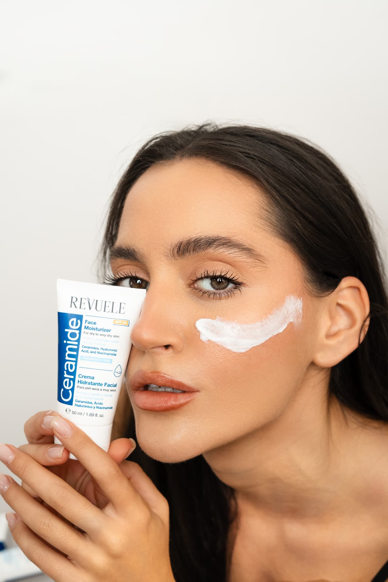 CERAMIDE Face Moisturizer SPF25 — packshot in use