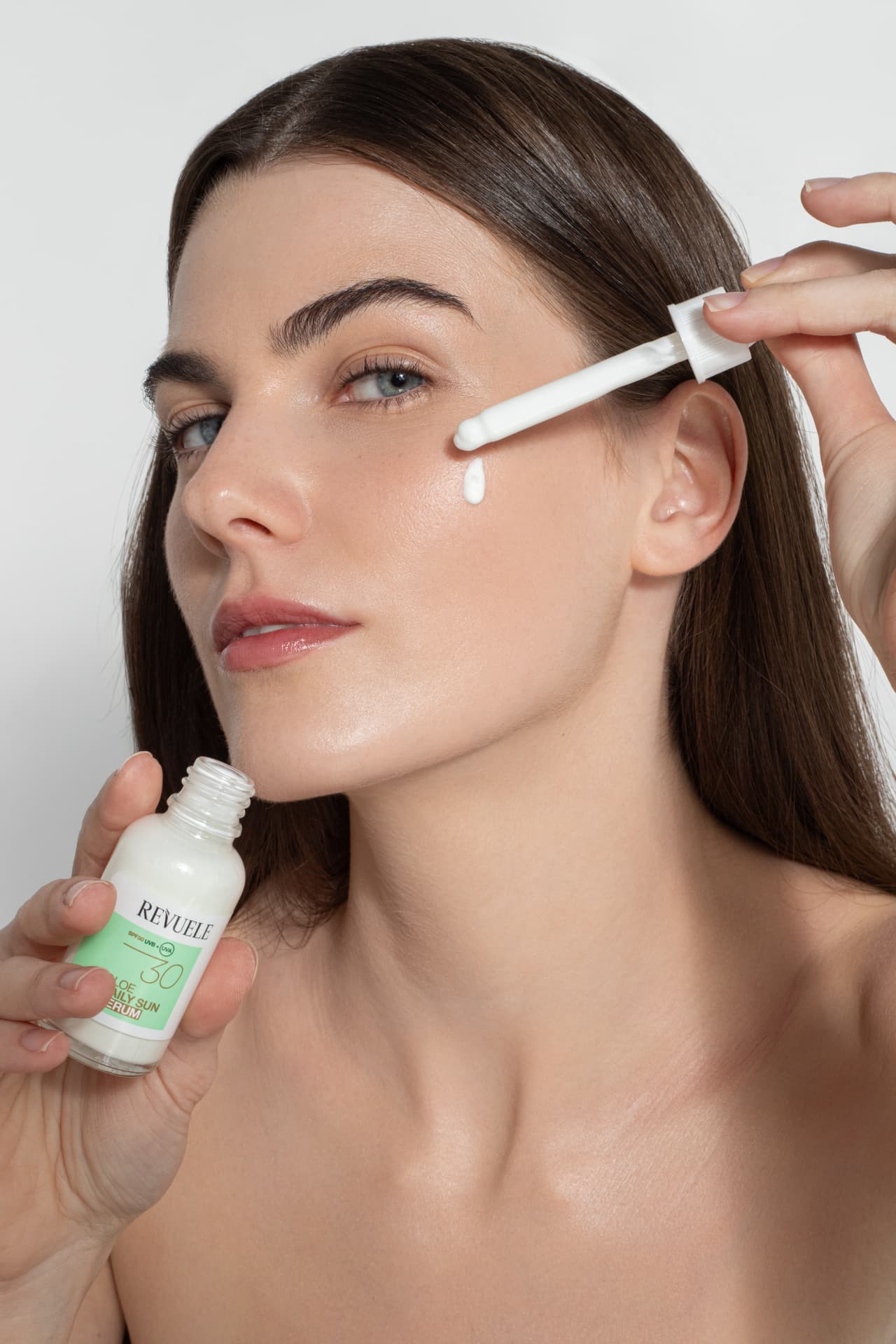 DAILY SUN Aloe Daily Sun Serum SPF 30 — packshot in use