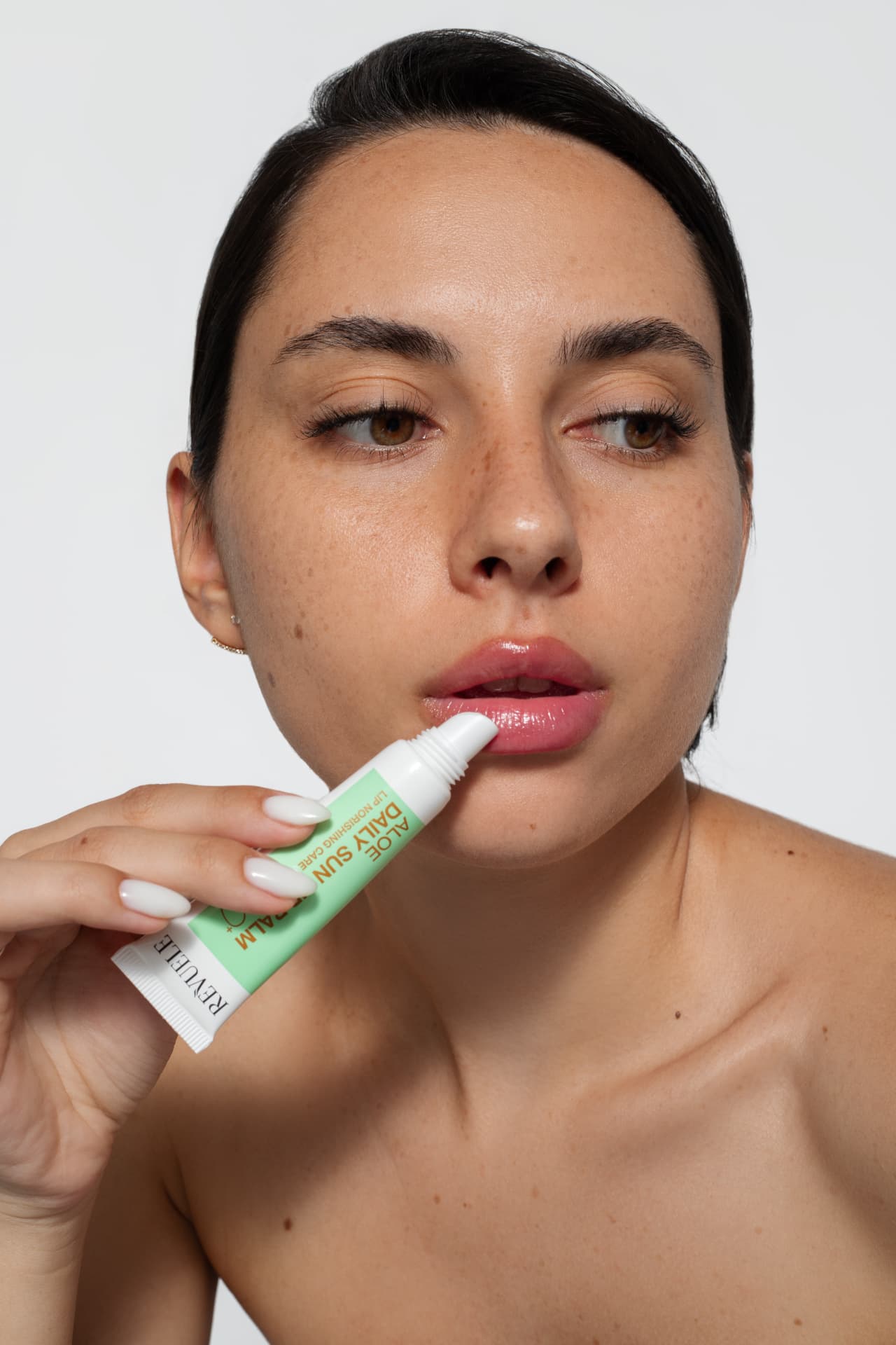 DAILY SUN Aloe Daily Sun Barrier SPF 50+ — packshot in use