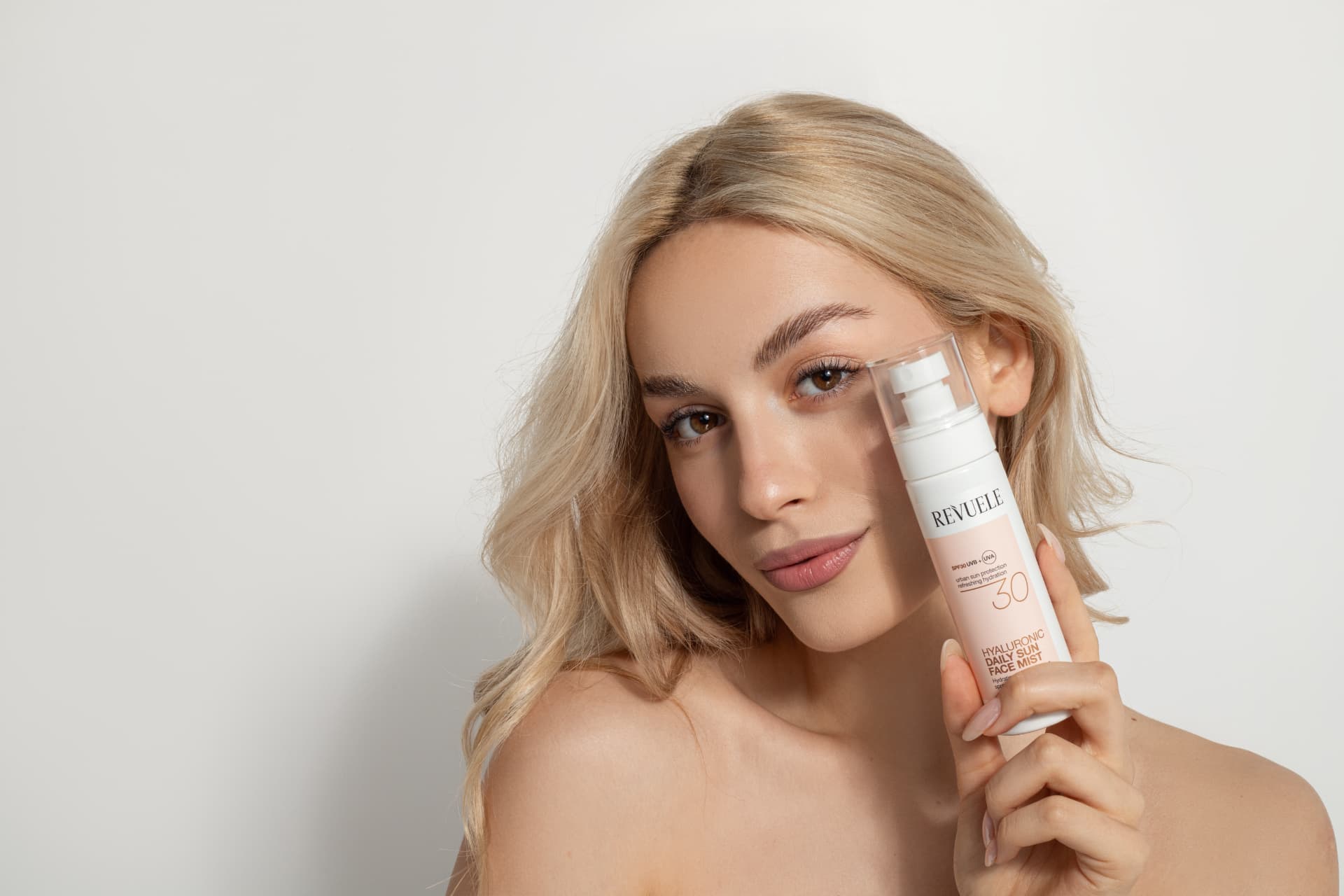 DAILY SUN Hyaluronic Daily Sun Face Mist SPF 30 — packshot in use
