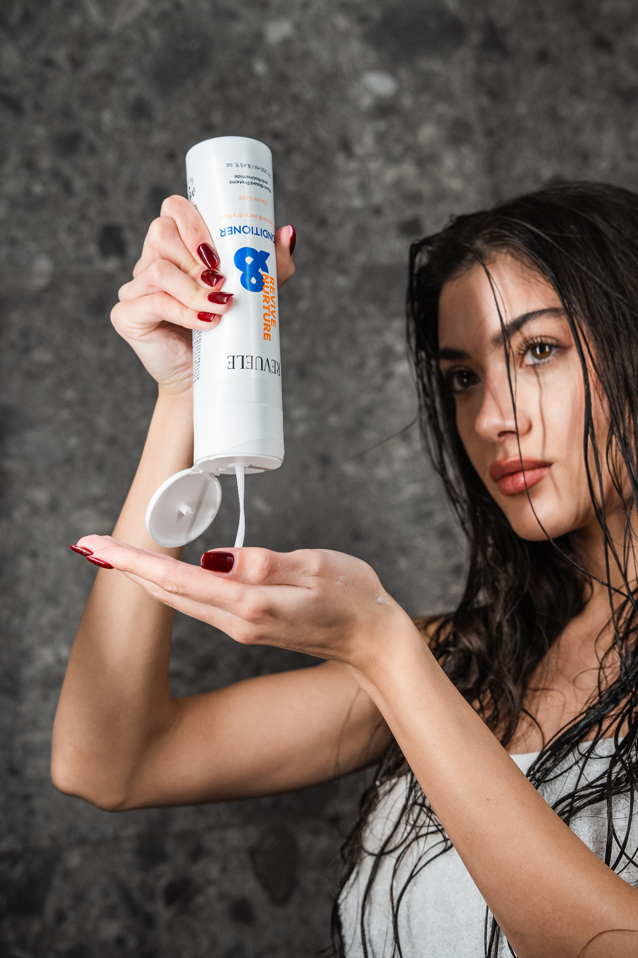 REVIVE & NURTURE Conditioner — packshot in use