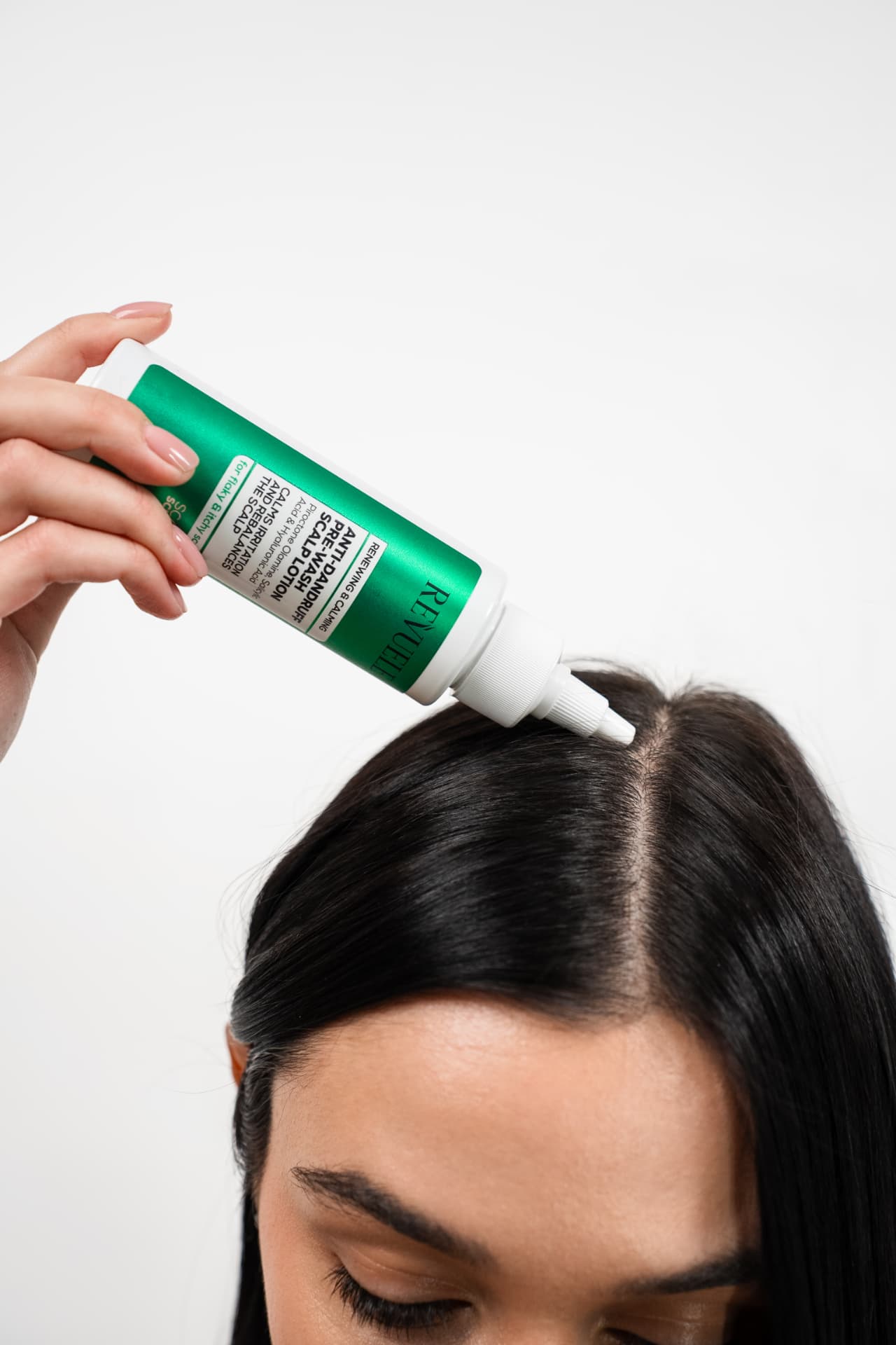 ANTI-DANDRUFF HAIR LINE Pre-Wash Scalp Lotion — packshot in use