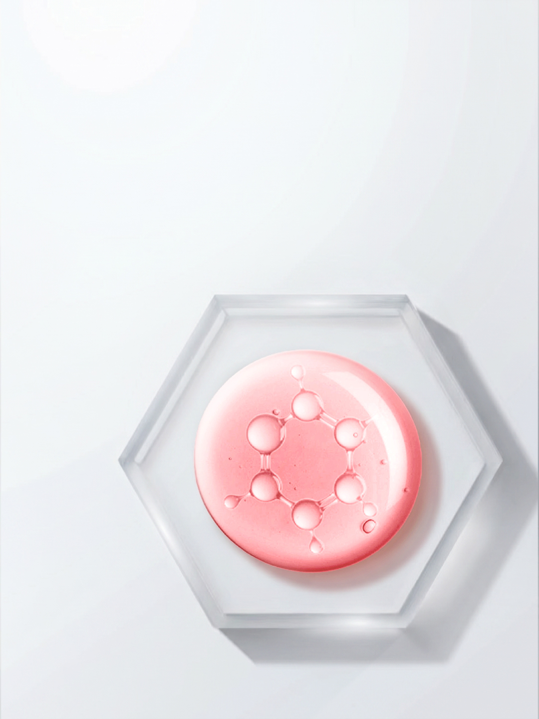 A pink droplet of PDRN serum showing a molecular pattern on a glass hexagon