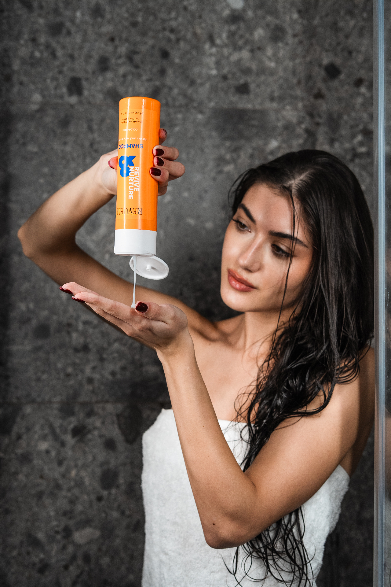 REVIVE & NURTURE Shampoo — packshot in use