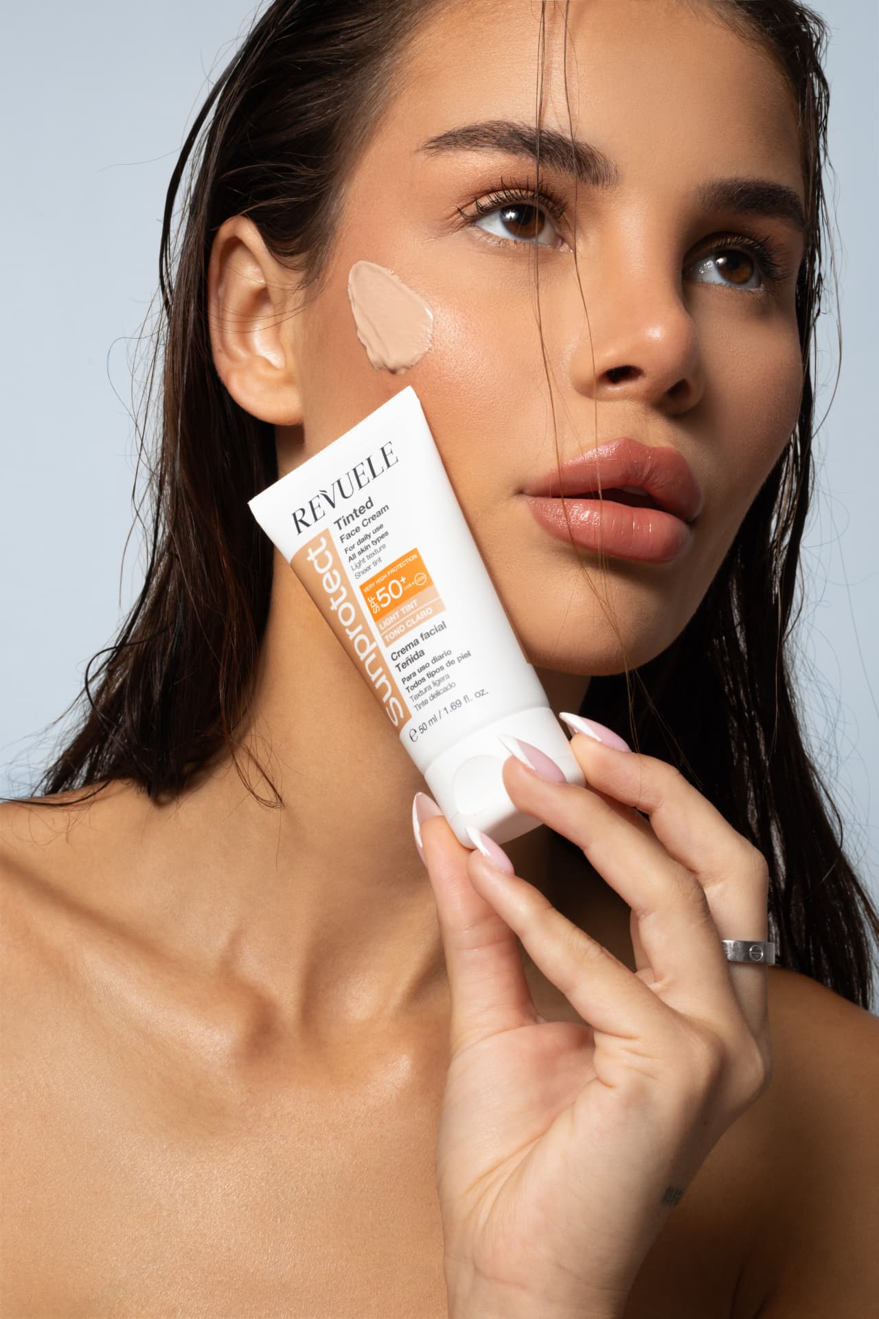 SUNPROTECT / TINTED Face Cream Light Tint, SPF 50+ — packshot in use