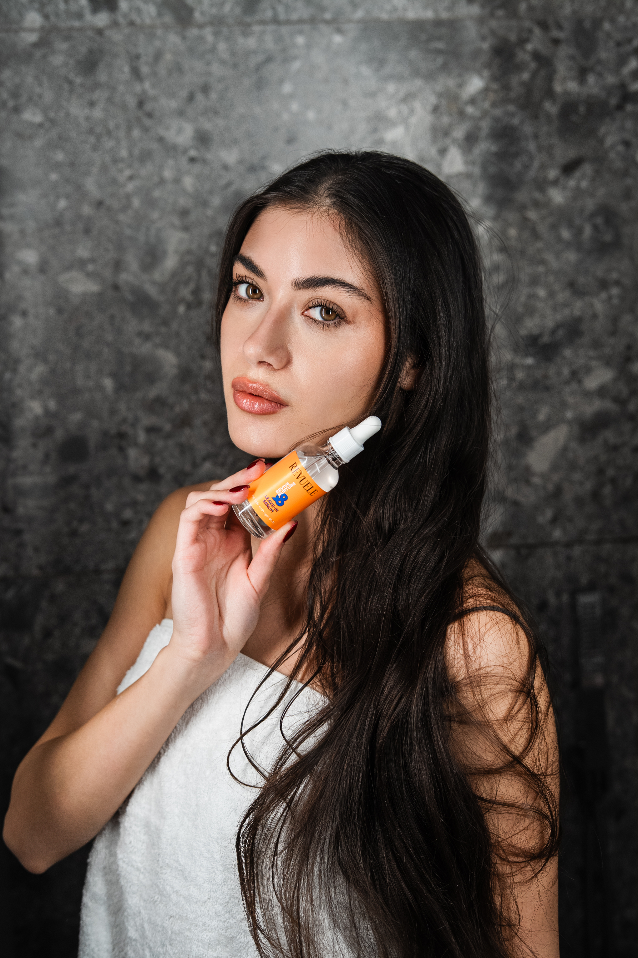 REVIVE & NURTURE Leave-In Serum — packshot in use
