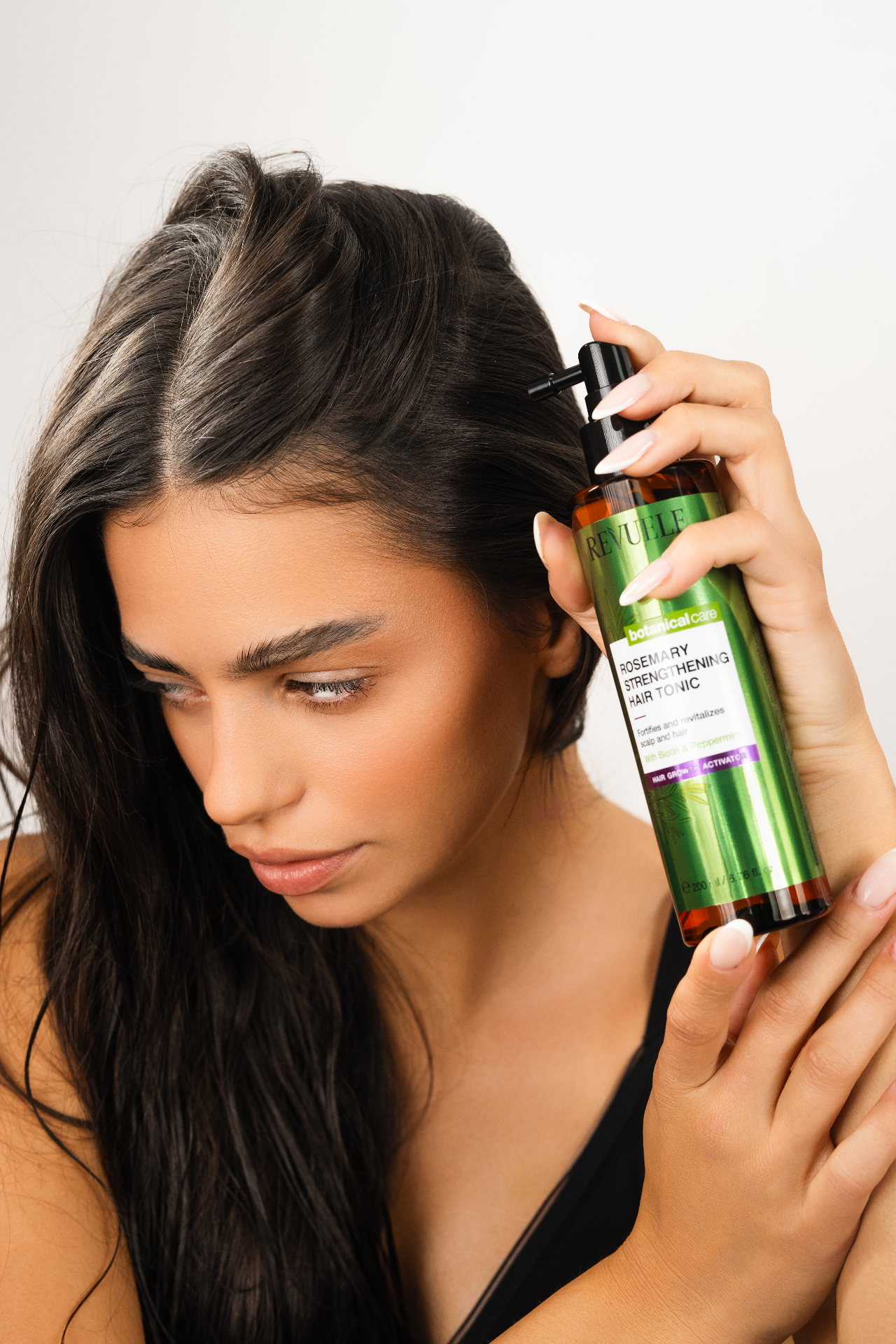 ROSEMARY HAIR GROWTH LINE Strengthening Hair Tonic — packshot in use